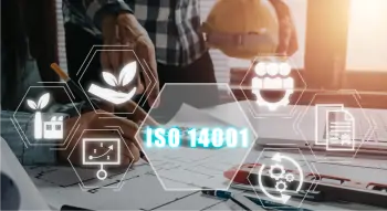 A person drawing with a bunch of hexagon shaped symbols relating to ISO 14001