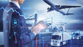 A businessman typing on a tablet with delivery trucks, an airplane, and a ship full of containers in the background along with text and charts